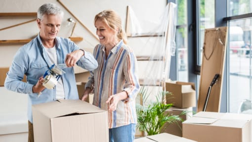 couple packing cardboard boxes