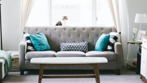 living room with grey sofa